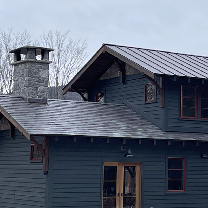 Slate roof on blue house