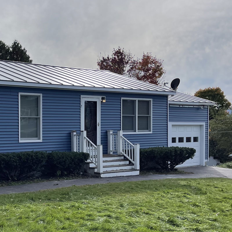 Metal roofing on blue house